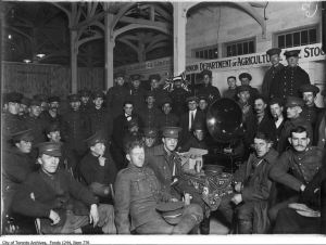 Soldiers listening to phonograph, Livestock Building CNE camp