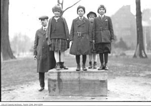 children at preaching stone in Queen's Park