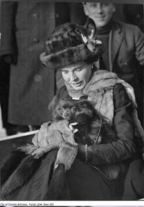 Woman with small dog and muff